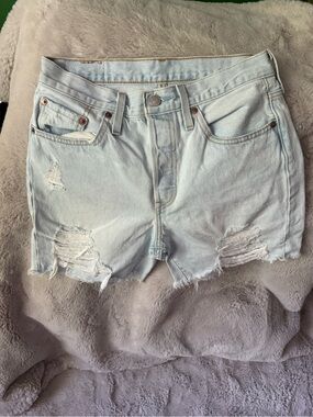 Levi’s 501 mid thigh Light Blue Distressed Denim Shorts - Women